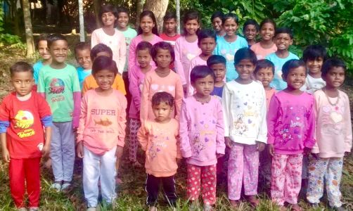Village children receive new clothes at Christmas.