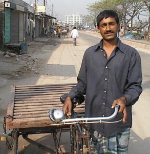 A new flatbed rickshaw begins a small hauling business.