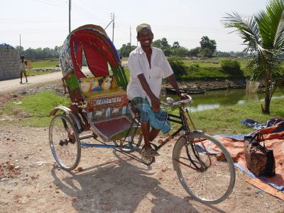 A newly self employed rickshaw owner, earns daily income from providing transport to others.